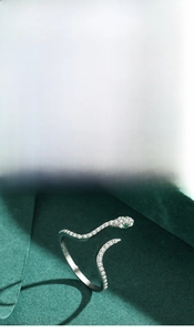 Detail of S925 silver snake rings with micro-pave crystals and S925 hallmark