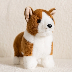 Realistic Corgi plush toy puppy with soft brown and white fur on cozy white texture
