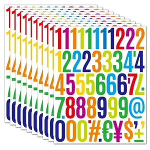Macro shot of 2-inch waterproof vinyl colorful number and currency symbol stickers