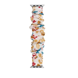 Close-up of floral print scrunchie watch band with silver connectors for Apple Watch