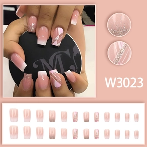 Short square press-on nails with nude pink gradient, silver glitter, and 24-piece full set
