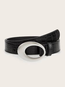 Detail of black crocodile texture leather belt with matte silver oval buckle