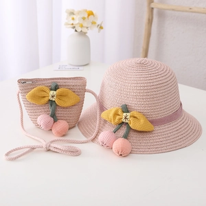 Pink straw hat and matching bag set with floral cherry accents for children's summer sun protection