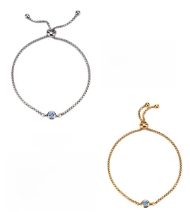 Detail of adjustable gold and silver sapphire bracelets for September birthdays