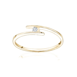 Macro shot of gold bypass ring featuring a sparkling round diamond and open band detail