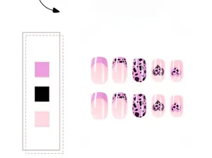 Detail of pink and black press on nails with heart prints and cow pattern design