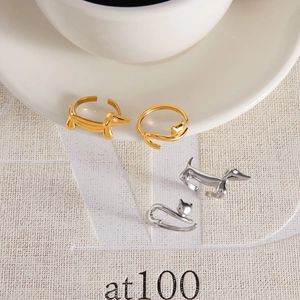 Close-up of adjustable stainless steel rings featuring cat and dachshund designs