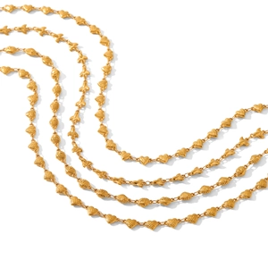 Gold stainless steel heart chain necklace with textured links on white background