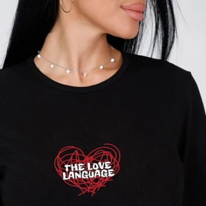 Women black t-shirt featuring red heart print and The Love Language text with silver necklace