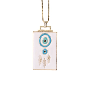 Detailed close-up of a gold square pendant with evil eye motif and feather engraving