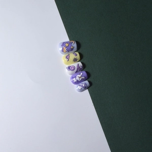 5-piece set of purple and yellow press-on nails with Halloween ghost and wizard patterns
