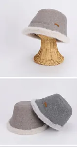 Detail view of plush Mongolian hat with wool felt finish and faux fur trim
