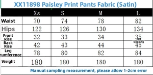 Detailed size chart for paisley print satin trousers showing measurements from XS to L
