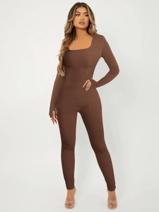 Close-up of brown ribbed knit jumpsuit featuring long sleeves and a square neckline