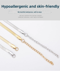 Detail view of gold and silver stainless steel flat snake chains with lobster clasps