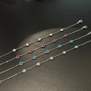 Detail of S925 sterling silver bracelets with colorful round opal and lobster clasp