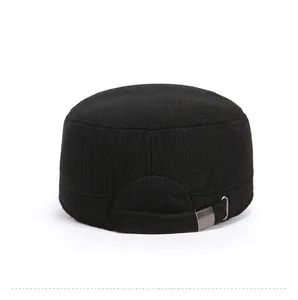 Detail of black cadet cap featuring adjustable metal buckle and textured fabric