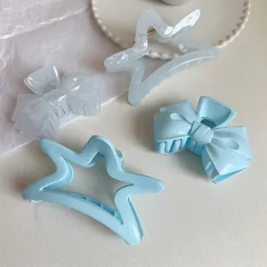 Blue and white acrylic hair claw clips set including star and bow shapes for women