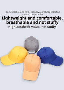 Close-up of four solid color breathable cotton baseball caps with adjustable metal buckles