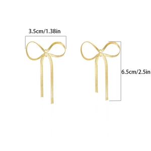 Detailed view of gold bow tassel earrings with dimensions 3.5cm width and 6.5cm height