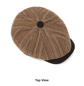 Top view of vintage newsboy cap in brown striped wool with black brim and button