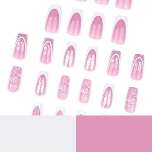 Pink and white gradient press-on nails with silver glitter and hand-painted hearts