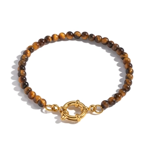 Macro view of tiger eye beaded bracelet with gold-plated spring clasp and silk luster