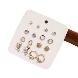 Set of 9 gold stainless steel stud earrings with pearls and crystal accents on card