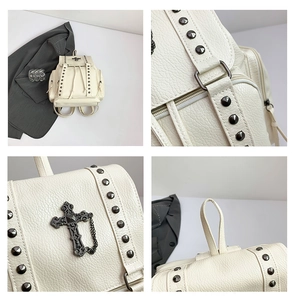 Detail view of a white PU leather backpack featuring gothic cross and metal rivets