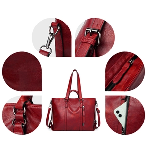Detail view of large red PU leather tote showing metal hardware and side phone pocket