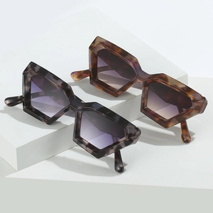 Irregular geometric oversized sunglasses in tortoiseshell and dark grey marble finish