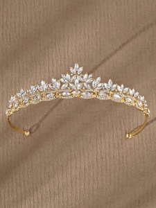 Macro detail of gold bridal crown featuring marquise crystals and rhinestones