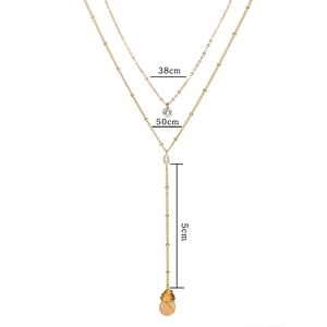 Detail view of the layered gold necklace featuring measurements 38cm, 50cm, and 5cm