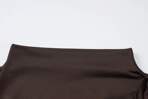 Detail shot of the boat neck and fine knit texture of the coffee brown slim dress