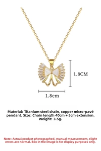 Detailed view of titanium steel bow necklace with micro-inlaid shell and cubic zirconia