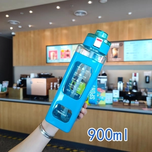 Detail of 900ml blue gradient water bottle with time markers and portable strap
