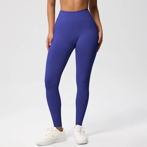 Detail of high-waisted seamless yoga leggings in dark blue showing elastic ribbed waistband