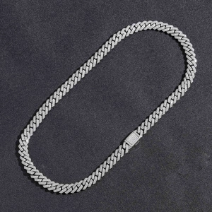 Macro shot of 10mm silver Cuban link necklace featuring a zircon-studded clasp closure