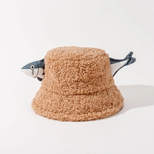Detail of creative brown sherpa bucket hat with fun blue fish decorations