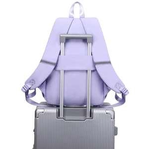Light purple backpack showing the trolley strap feature for secure travel attachment