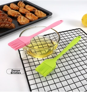 Detail of pink and green silicone pastry brushes with dense bristles for BBQ and baking
