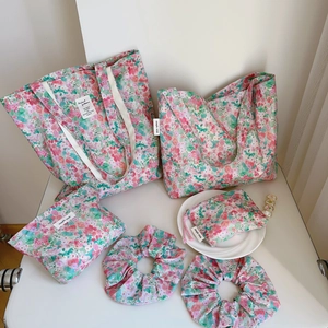 Six-piece floral cotton bag set with totes and pouches in pink meadow print