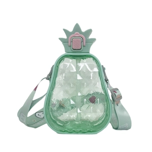 Close-up of pineapple shaped water bottle in mint green with adjustable strap