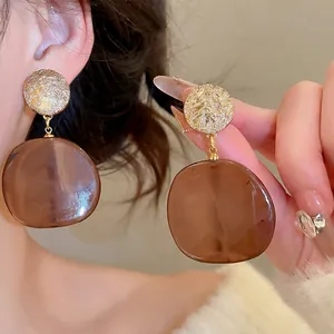 Minimalist round brown resin drop earrings with golden textured studs for women