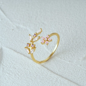 Detail of 925 silver leaf ring with pink floral zircon and marquise purple stones