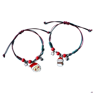 Red and green woven Christmas couple bracelets with Santa and Snowman charms