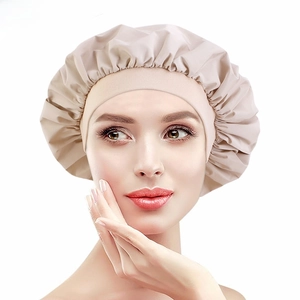 Detail of wide elastic band on beige waterproof shower cap for hair protection and comfort