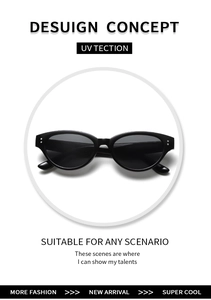 Close-up of cat eye sunglasses with sleek black frame and silver double-dot rivets