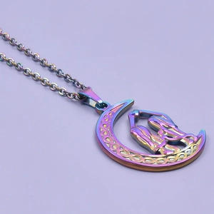 Detail of rainbow crescent moon pendant with Celtic knots and hugging figures