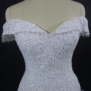Elegant off-shoulder mermaid wedding dress with intricate crystal sequins and beads